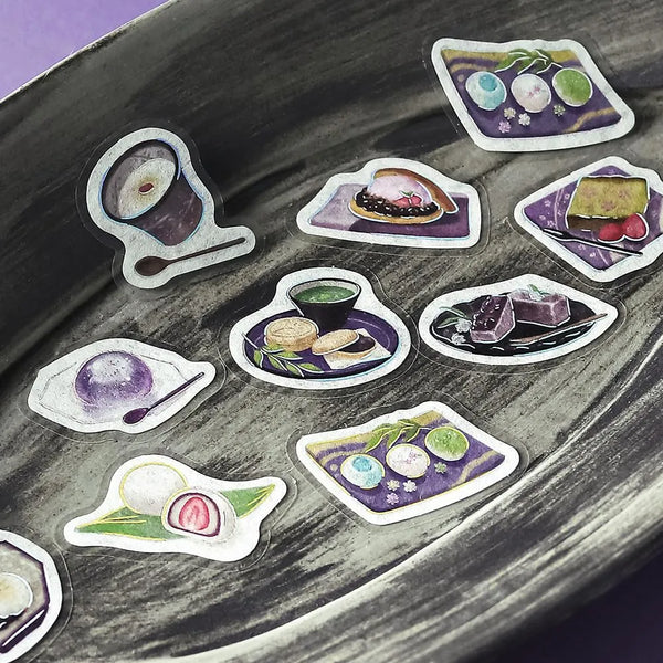 将图片加载到图库查看器,Purple café-themed flake sticker sheet featuring traditional sweets, tea cups and parfaits with metallic foil details.