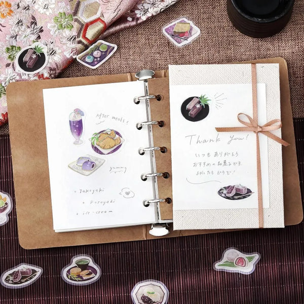 将图片加载到图库查看器,Purple café-themed flake sticker sheet featuring traditional sweets, tea cups and parfaits with metallic foil details.