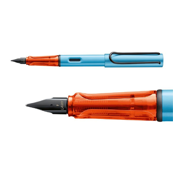 将图片加载到图库查看器,LAMY AL-star fountain pen in matte denim blue with a translucent orange grip, black steel nib, and metal clip.