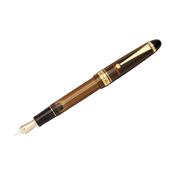 Load image into Gallery viewer, Pilot Custom 823 Fountain Pen in transparent amber brown resin with gold trim and 14K gold nib, featuring vacuum ink filling system – ideal for extended writing with elegance and precision.