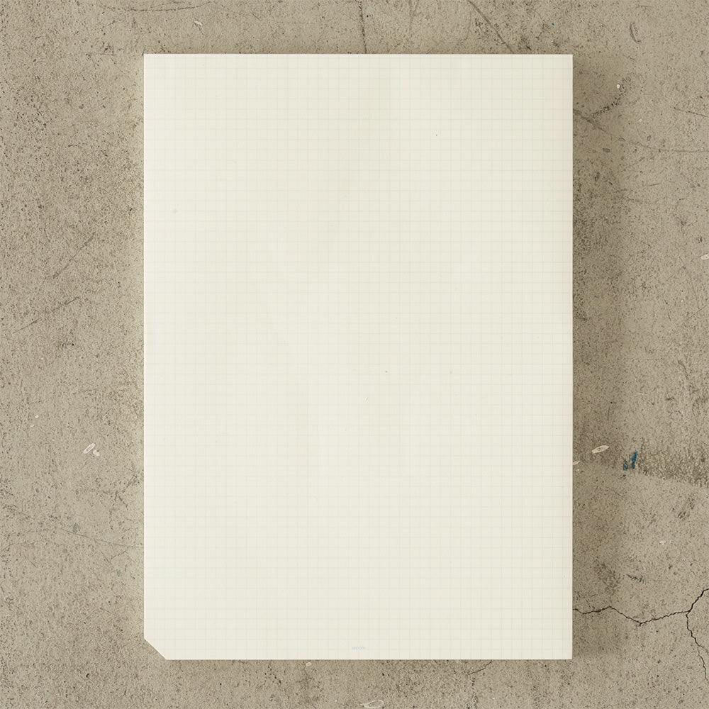 MD Notebook Paper Pad A4 - Grid — open spread