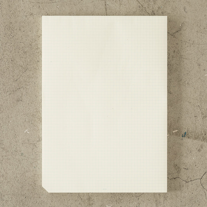 MD Notebook Paper Pad A4 - Grid — open spread