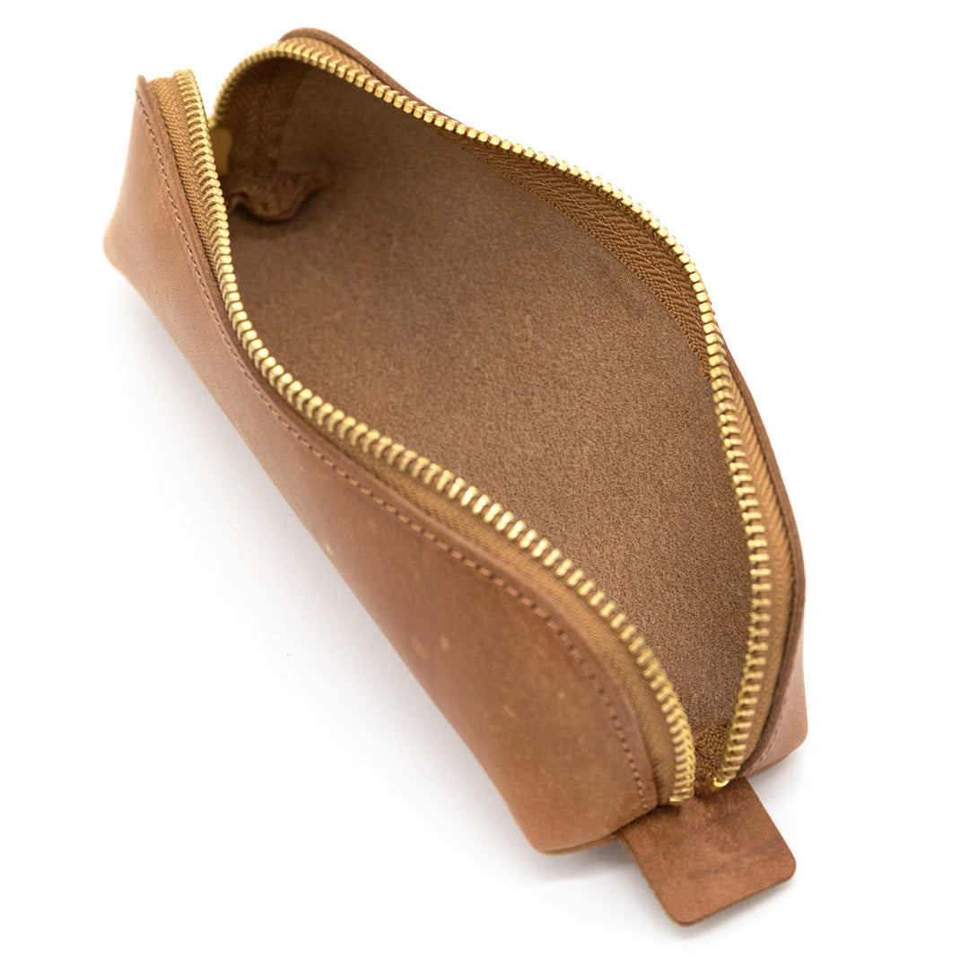 Luddite MAYA Arch Pencase - Whisky Brown — writing at an angle