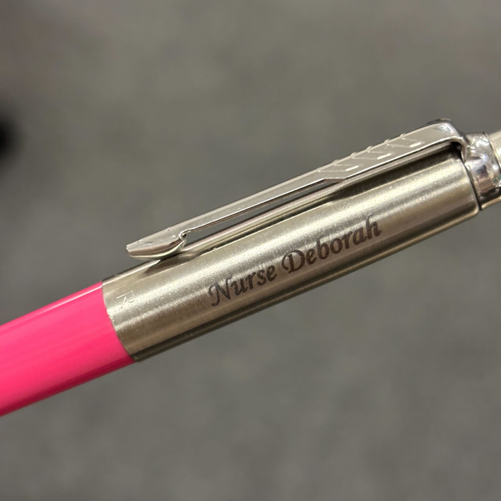 Personalised name engraving close-up on Parker Jotter Originals Hot Pink Ballpoint Pen — Cityluxe
