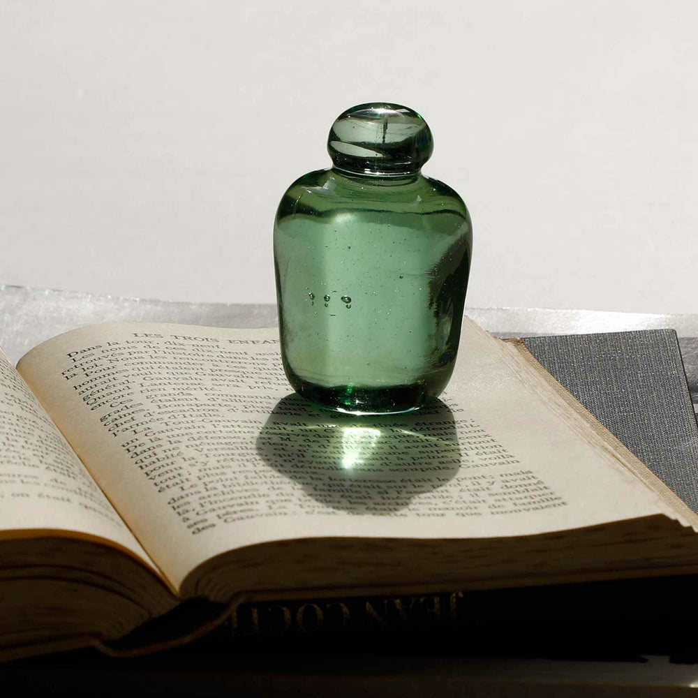 Attaché Recycled Glass Paperweight made from Georgia green recycled Coca-Cola glass with visible air bubbles.