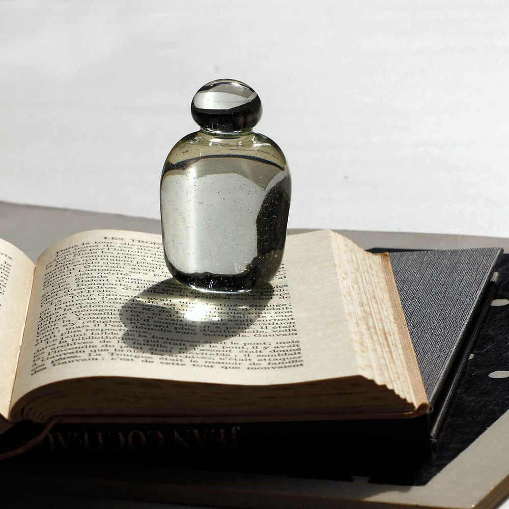 Attaché Recycled Glass Paperweight made from milky white recycled glass with a smooth, minimalist finish.