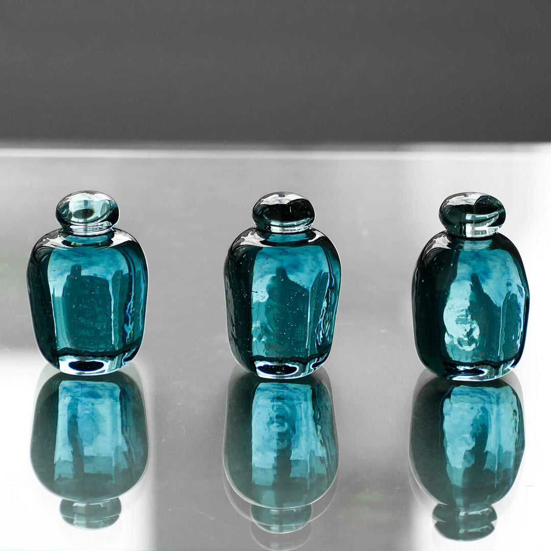 Attaché Recycled Glass Paperweight made from recycled soda bottle glass with a soft pale blue tint.