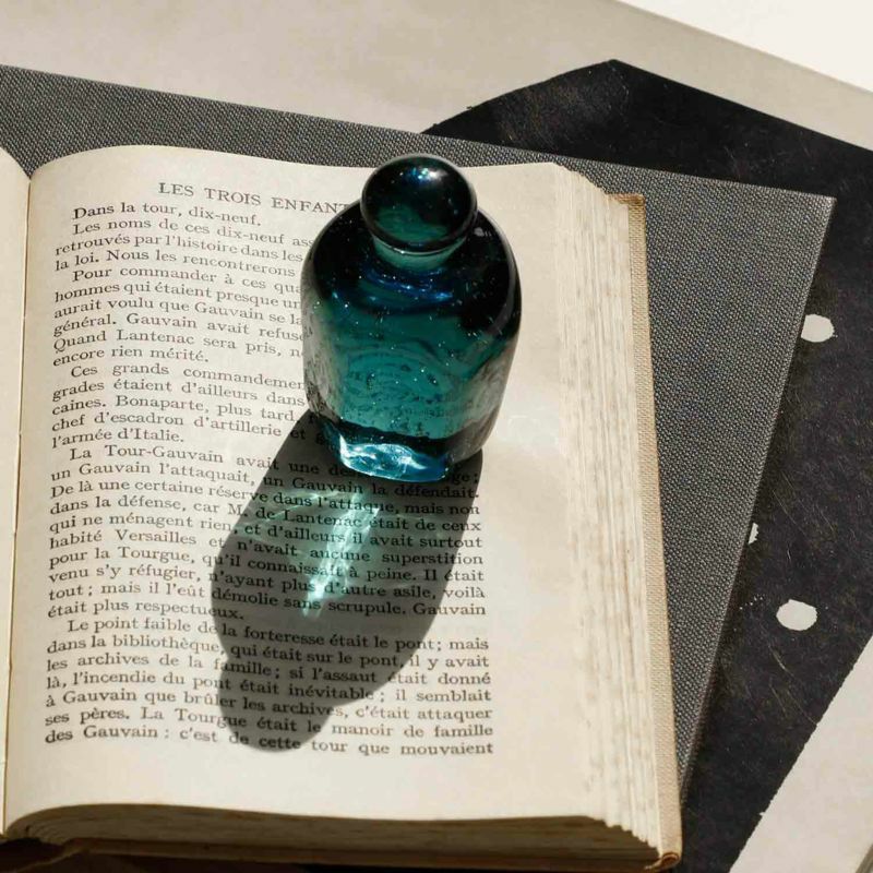 Attaché Recycled Glass Paperweight made from recycled soda bottle glass with a soft pale blue tint.