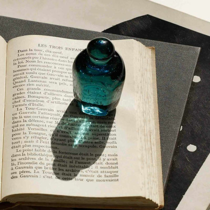Attaché Recycled Glass Paperweight made from recycled soda bottle glass with a soft pale blue tint.