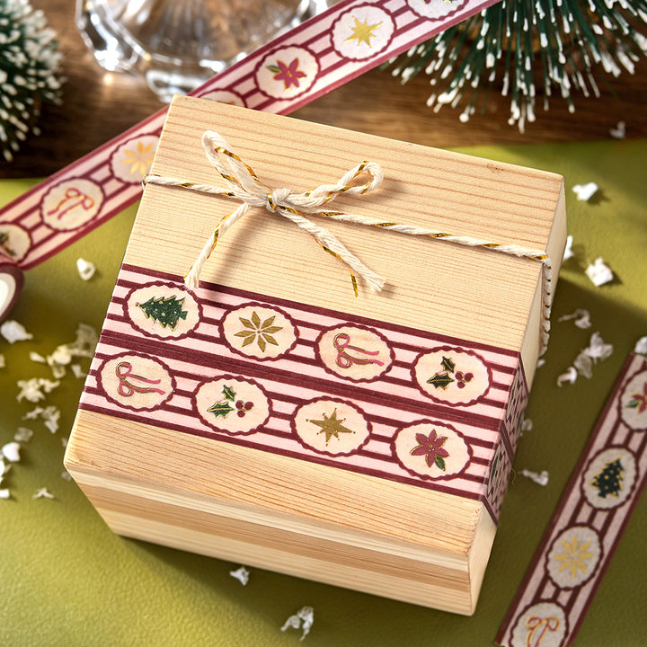 Wooden gift box wrapped with two bands of BGM Holiday Pattern washi tape and tied with gold and cream twine