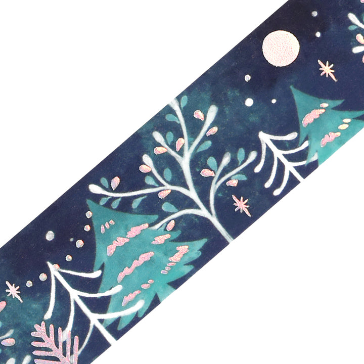 Close-up of BGM Moonlit Forest washi tape: white branches, teal fir trees and iridescent foil moon, stars and snow
