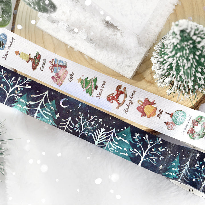 BGM Pieni Stitch and Moonlit Forest Christmas washi tapes, the two 20mm designs, on a wooden slice with snow