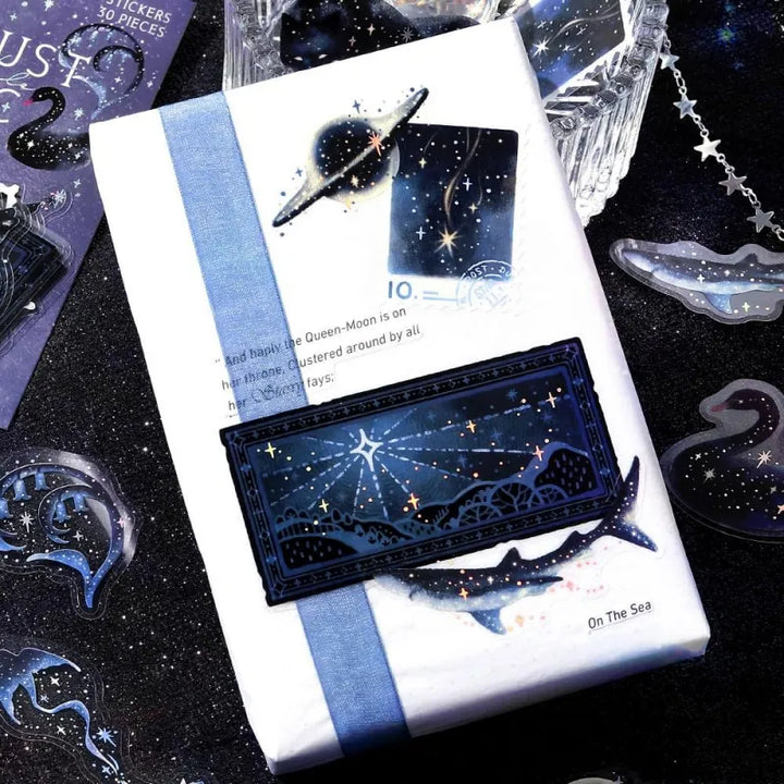 BGM Foil Stamping Clear Seal – Stardust Magic: Black Hole with 30 PET sheets of dark, cosmic designs featuring swirling patterns, stars, and foil accents in deep space tones.