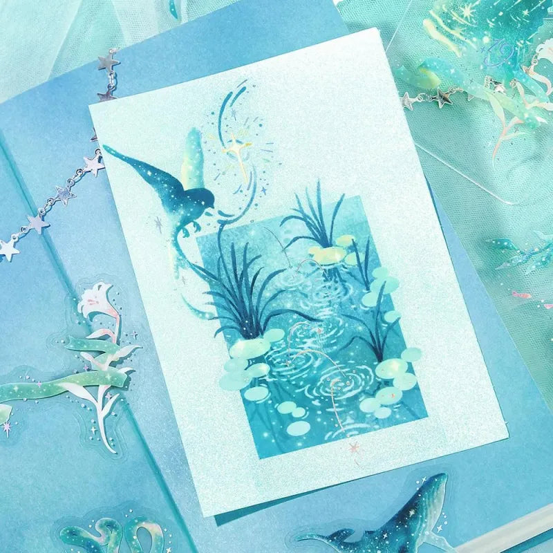 BGM Foil Stamping Clear Seal – Stardust Magic: Earth edition with 30 PET sheets featuring 10 foil-accented stickers per sheet. Designs include skies, clouds, greenery, and planetary motifs in an Earth-inspired color palette.