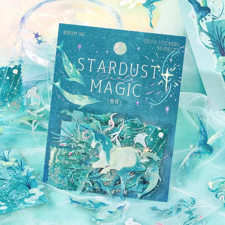 BGM Foil Stamping Clear Seal – Stardust Magic: Earth edition with 30 PET sheets featuring 10 foil-accented stickers per sheet. Designs include skies, clouds, greenery, and planetary motifs in an Earth-inspired color palette.