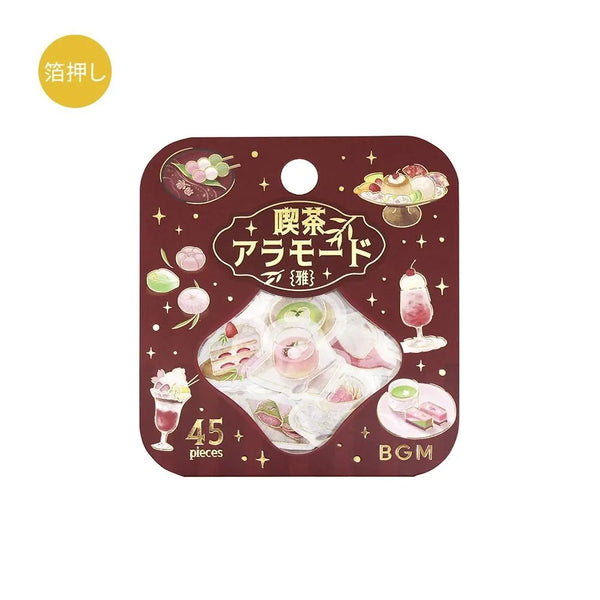 Pink-toned café flake stickers showing cakes, parfaits and delicate desserts with warm foil accents on washi paper.