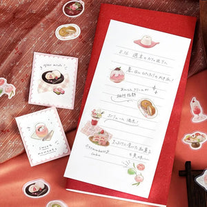 Pink-toned café flake stickers showing cakes, parfaits and delicate desserts with warm foil accents on washi paper.