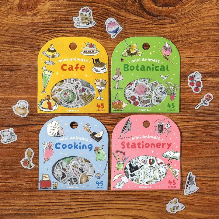 BGM Foil Stamping Flake Seal – Mini Mini Animals series includes 45 foil-accented washi stickers per set, featuring adorable animal illustrations across four charming themes: Café, Botanical, Cooking, and Stationery. Each sticker is made with textured washi paper and detailed with elegant foil stamping.