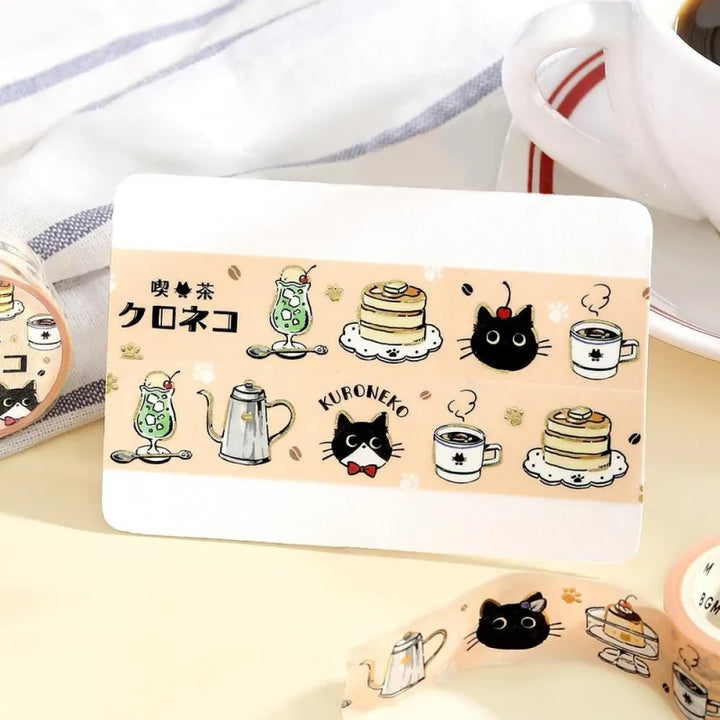 BGM Foil Stamping Masking Tape – Black Cat Café: Welcome design featuring black cats with desserts, soft pastel frames, and foil accents on 20mm washi tape.