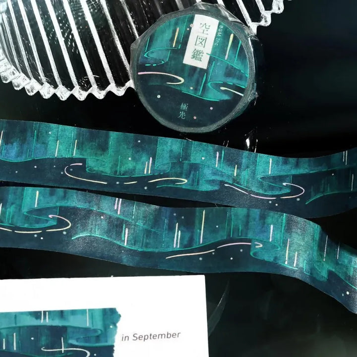 BGM Foil Stamping Masking Tape – Sky Encyclopedia: Aurora design with green and teal gradients, shimmering foil light trails, and starry details on a 20mm washi tape roll.