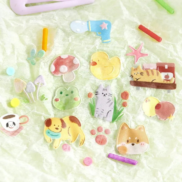 BGM Seat Seal – Animal Meets featuring one PET sticker sheet with cute animals like bears, cats, and rabbits interacting with teacups, books, and snacks. Stickers have a glossy embossed texture and playful pastel tones.