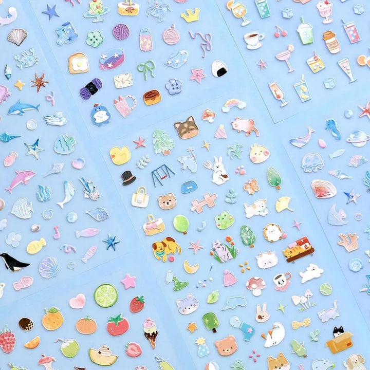 BGM Seat Seal – Animal Meets featuring one PET sticker sheet with cute animals like bears, cats, and rabbits interacting with teacups, books, and snacks. Stickers have a glossy embossed texture and playful pastel tones.