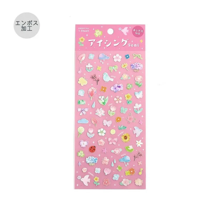 BGM Seat Seal – Bloom with one PET sticker sheet featuring delicate flowers, birds, bows, and gentle accents in pastel tones. Stickers have a glossy embossed finish.