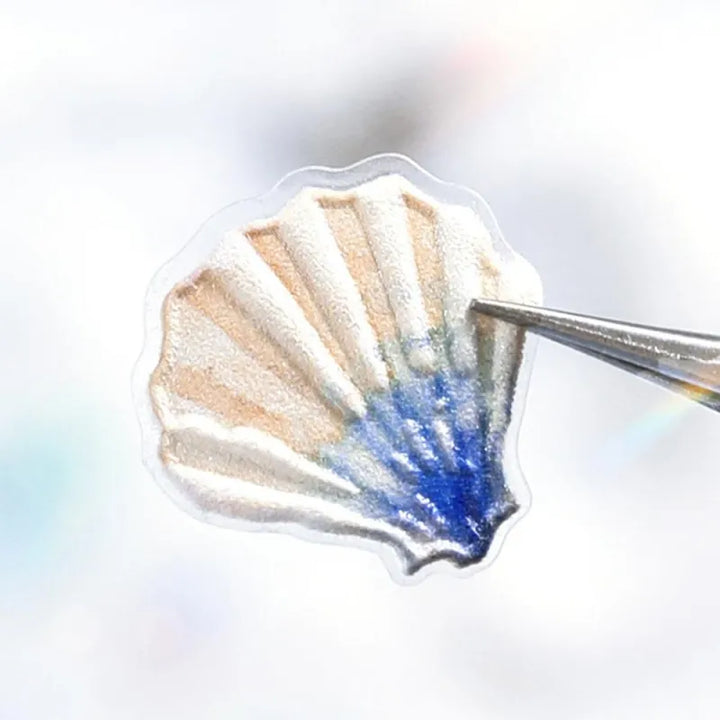 BGM Seat Seal – Ocean and Cosmos with a single PET sticker sheet featuring celestial and sea-themed icons like stars, shells, constellations, and sea creatures in pastel hues with a glossy embossed finish.