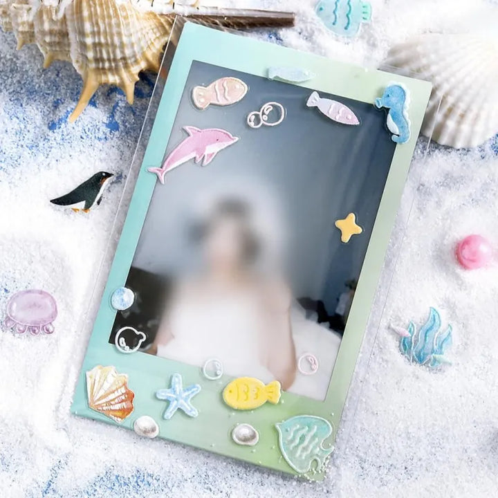 BGM Seat Seal – Ocean and Cosmos with a single PET sticker sheet featuring celestial and sea-themed icons like stars, shells, constellations, and sea creatures in pastel hues with a glossy embossed finish.