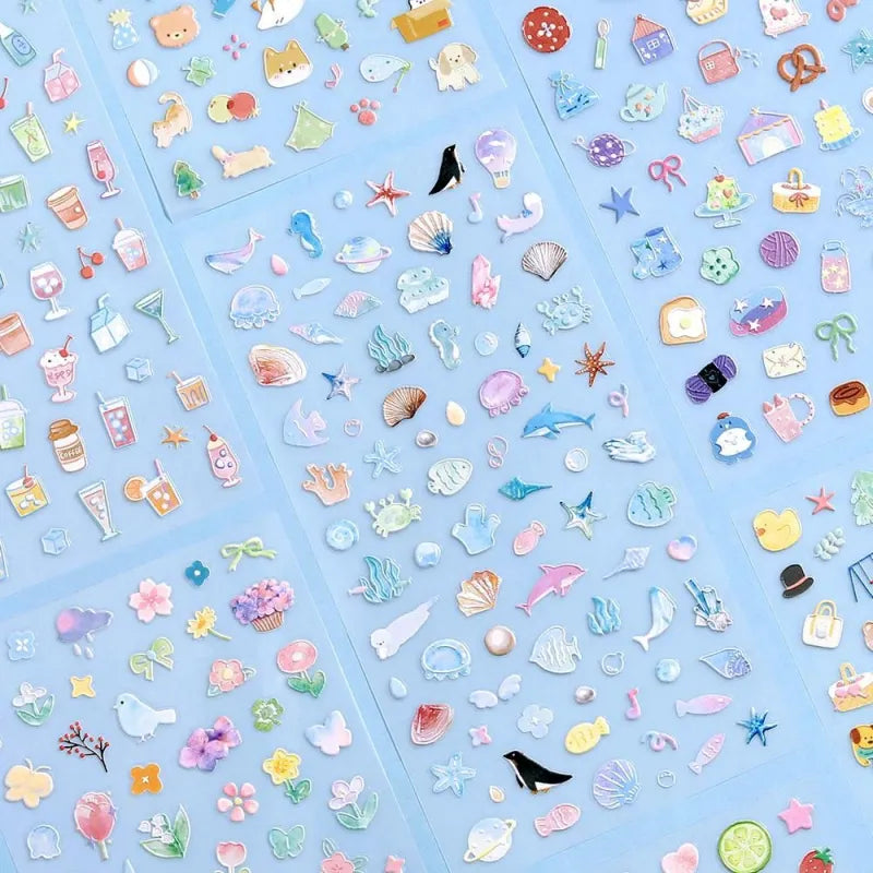 BGM Seat Seal – Ocean and Cosmos with a single PET sticker sheet featuring celestial and sea-themed icons like stars, shells, constellations, and sea creatures in pastel hues with a glossy embossed finish.