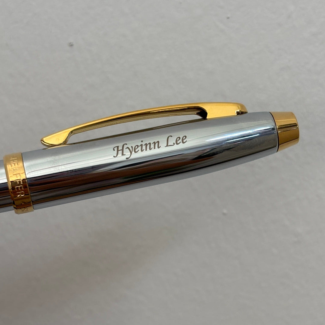 Custom Pen Engraving – Personalised Name Engraving on Sheaffer 100 E9340 Bright Chrome With Gold Trims Ballpoint Pen at Cityluxe WorkRoom