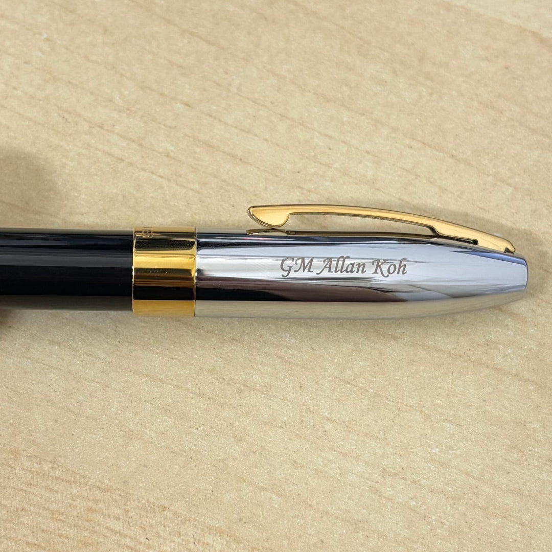 Custom Pen Engraving – Personalised Name Engraving on Sheaffer Legacy 9065 Bi-color Black Barrel and Chrome Cap Rollerball Pen with 14K IP Gold-Plated Trims at Cityluxe WorkRoom