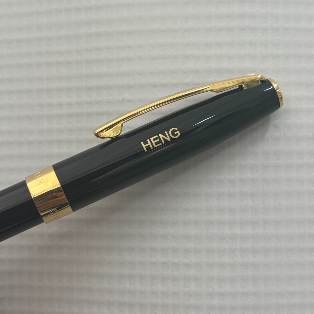 Custom Pen Engraving – Personalised Name Engraving on Sheaffer SAGARIS E9471 Gloss Black With Gold Tone Trim Fountain Pen at Cityluxe WorkRoom