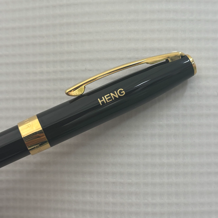 Custom Pen Engraving – Personalised Name Engraving on Sheaffer SAGARIS E9471 Gloss Black With Gold Tone Trim Fountain Pen at Cityluxe WorkRoom