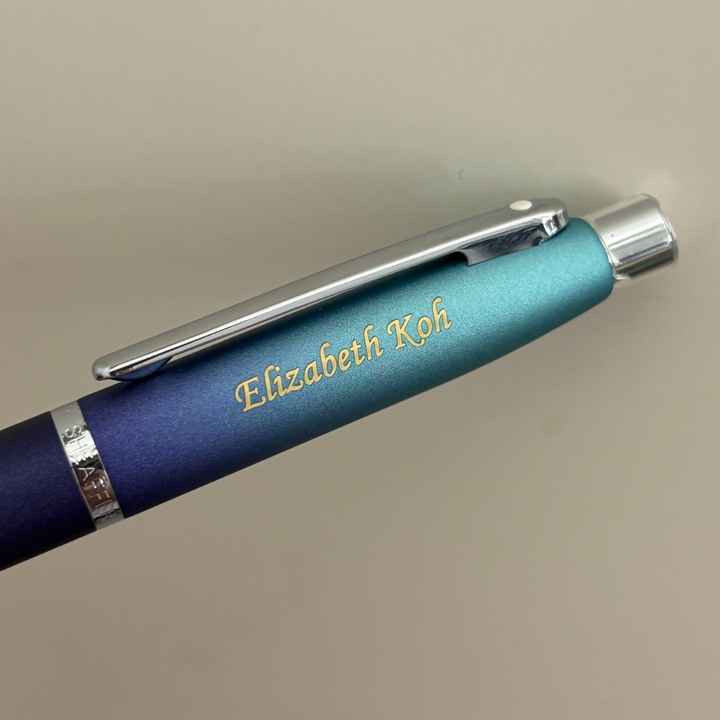 Custom Pen Engraving – Personalised Name Engraving on Sheaffer VFM 9430 Expressions Blue and Purple Pearlised Gradient Ballpoint Pen with Chrome-Plated Trims at Cityluxe WorkRoom