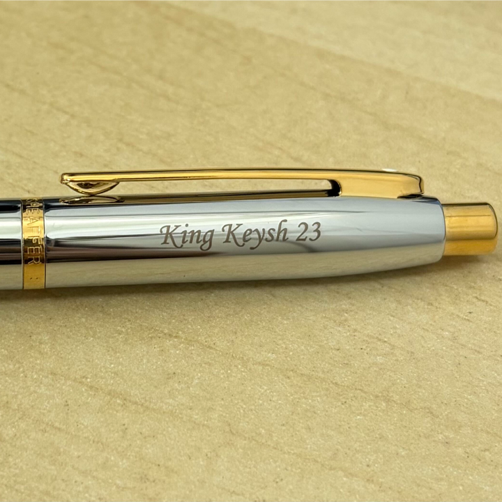 Custom Pen Engraving – Personalised Name Engraving on Sheaffer VFM E9422 Polished Chrome with Gold Trims Ballpoint Pen at Cityluxe WorkRoom