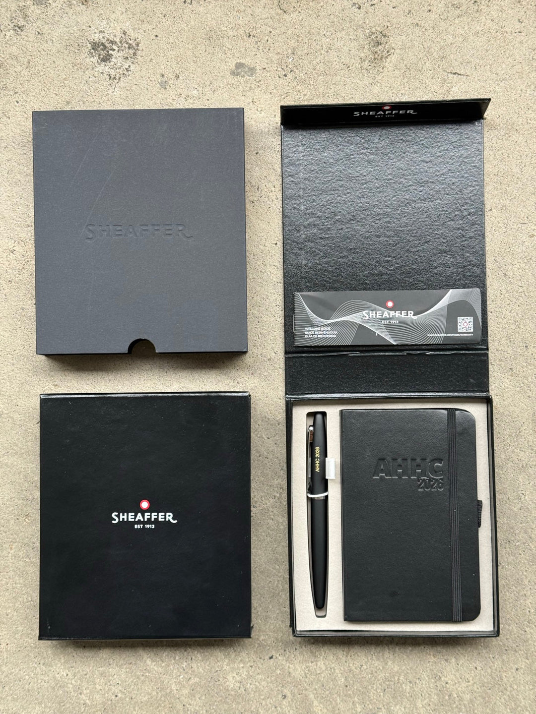 Demant AHHC 2026 corporate gift set — Sheaffer VFM Matte Black Rollerball Pen with embossed A6 notebook, engraved, 170 sets shipped to Kuala Lumpur by Cityluxe Singapore