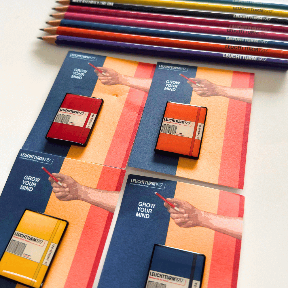 Close-up of Leuchtturm1917 mini hardcover notebook pins showing elastic band and cover label detail