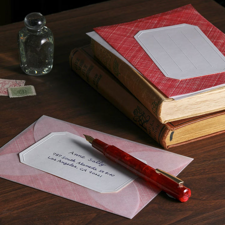 Hightide Attaché Marbled Fountain Pen - Dark Red — writing at an angle