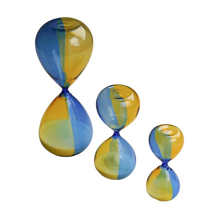 Bicolor Hightide hourglass in yellow and light blue glass with white sand, small 5-minute timer.