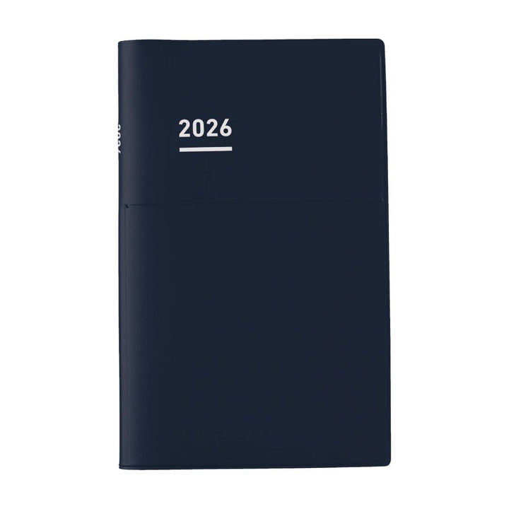 A professional A5 slim planner with a matte navy PVC cover and integrated pen holder. The refined monochrome design opens to neatly structured layouts—weekly vertical schedules, monthly blocks, project planning pages, and personal lists—all printed on smooth MIO PAPER for a premium, smudge-resistant writing experience.