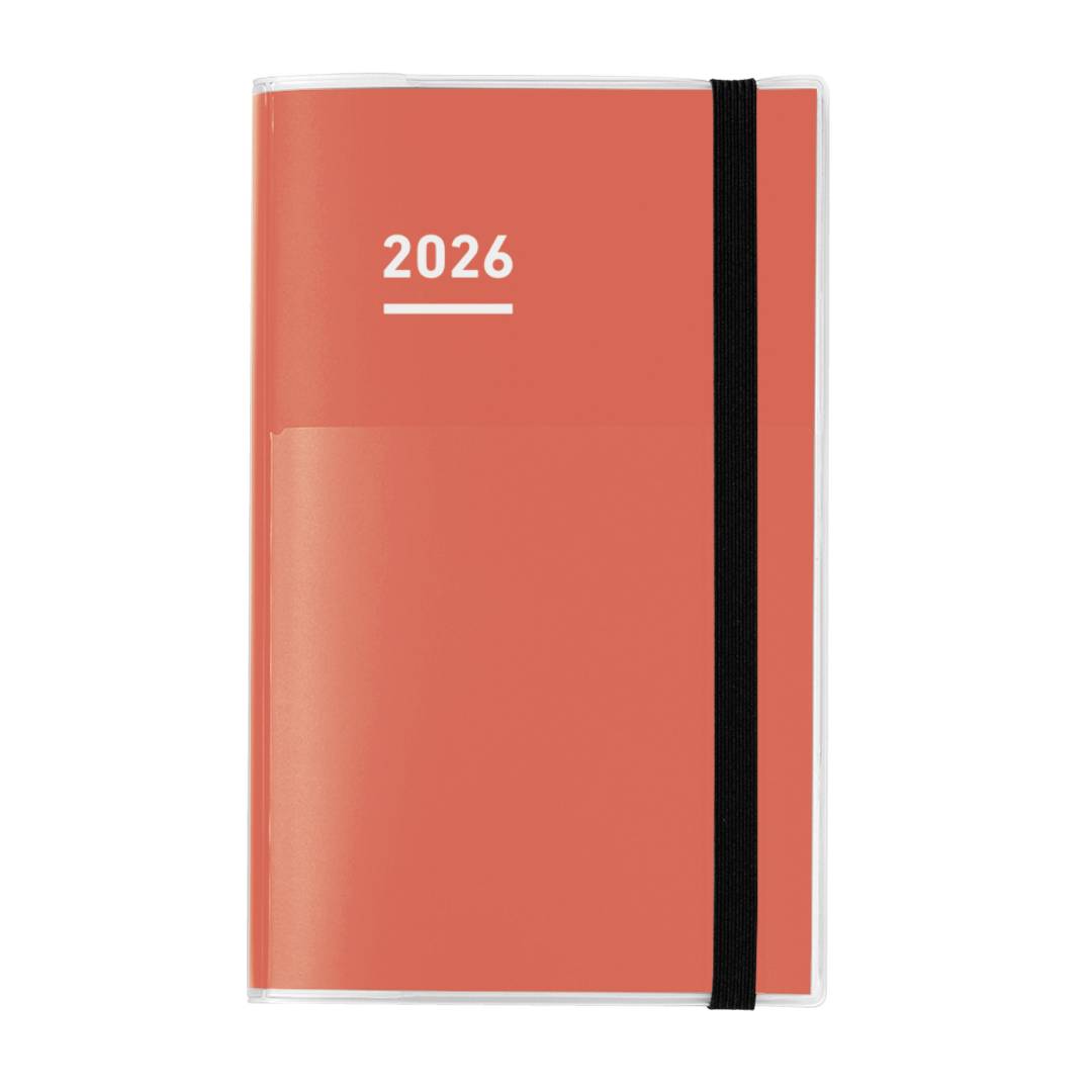 A sleek Kokuyo Jibun Techo First Kit in A5 Slim size with a red matte cover and built-in pen holder. The set includes three booklets—DIARY for schedules, LIFE for personal milestones, and IDEA for notes—offering a complete system for planning, reflection, and creativity.