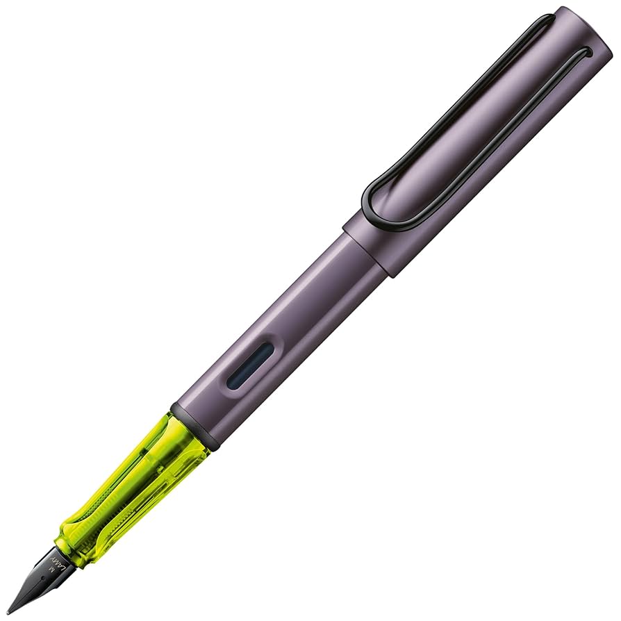 LAMY AL-star fountain pen in metallic aubergine with a translucent neon yellow grip, black steel nib, and metal clip. Includes a blue ink cartridge.