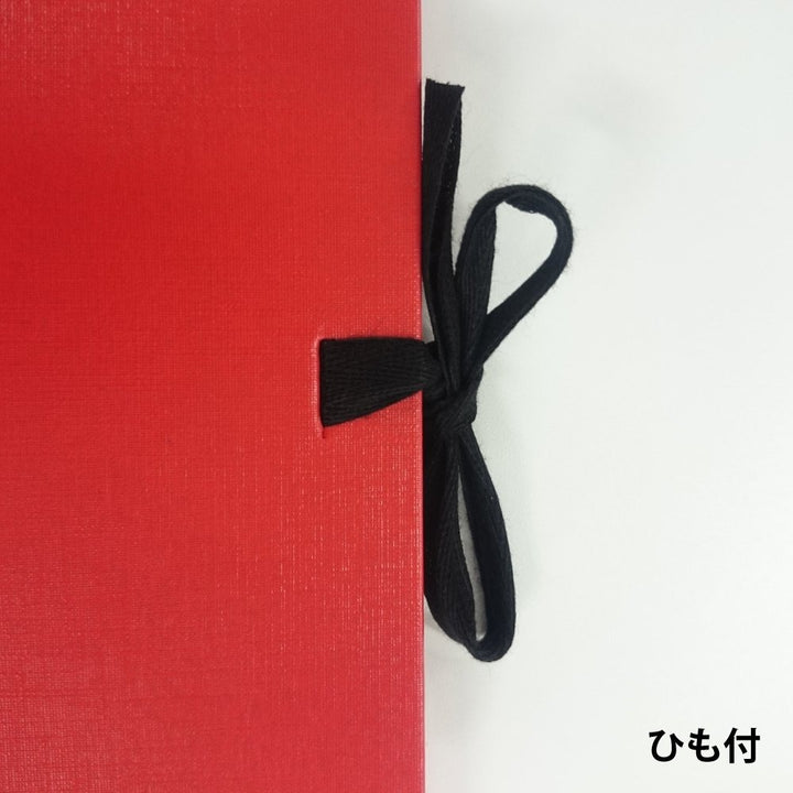 Maruman F6 Art Spiral sketchbook in red, close-up of the black ribbon tie closure