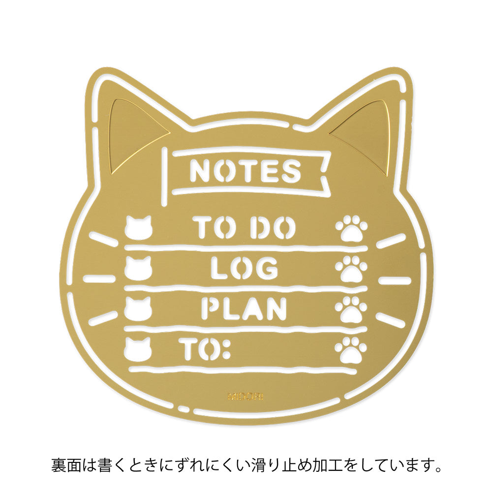 A slim brass stencil with cut-out cat faces, paw prints, and checklist boxes, designed for decorating planners, notebooks, and memos.