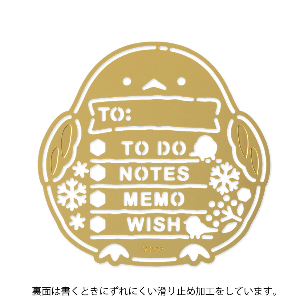 A slim brass stencil with cut-out illustrations of long-tailed tits, snowflakes, berries, and checklist boxes, designed for decorating planners, notebooks, and memos.