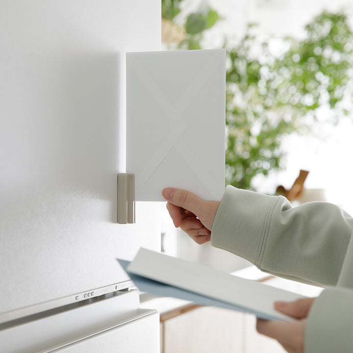 Midori Magnet Letter Cutter Ceramic Blade Beige - fixed to a wall while opening an envelope