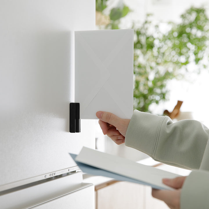 Midori Magnet Letter Cutter Ceramic Blade Black - fixed to a wall while opening an envelope