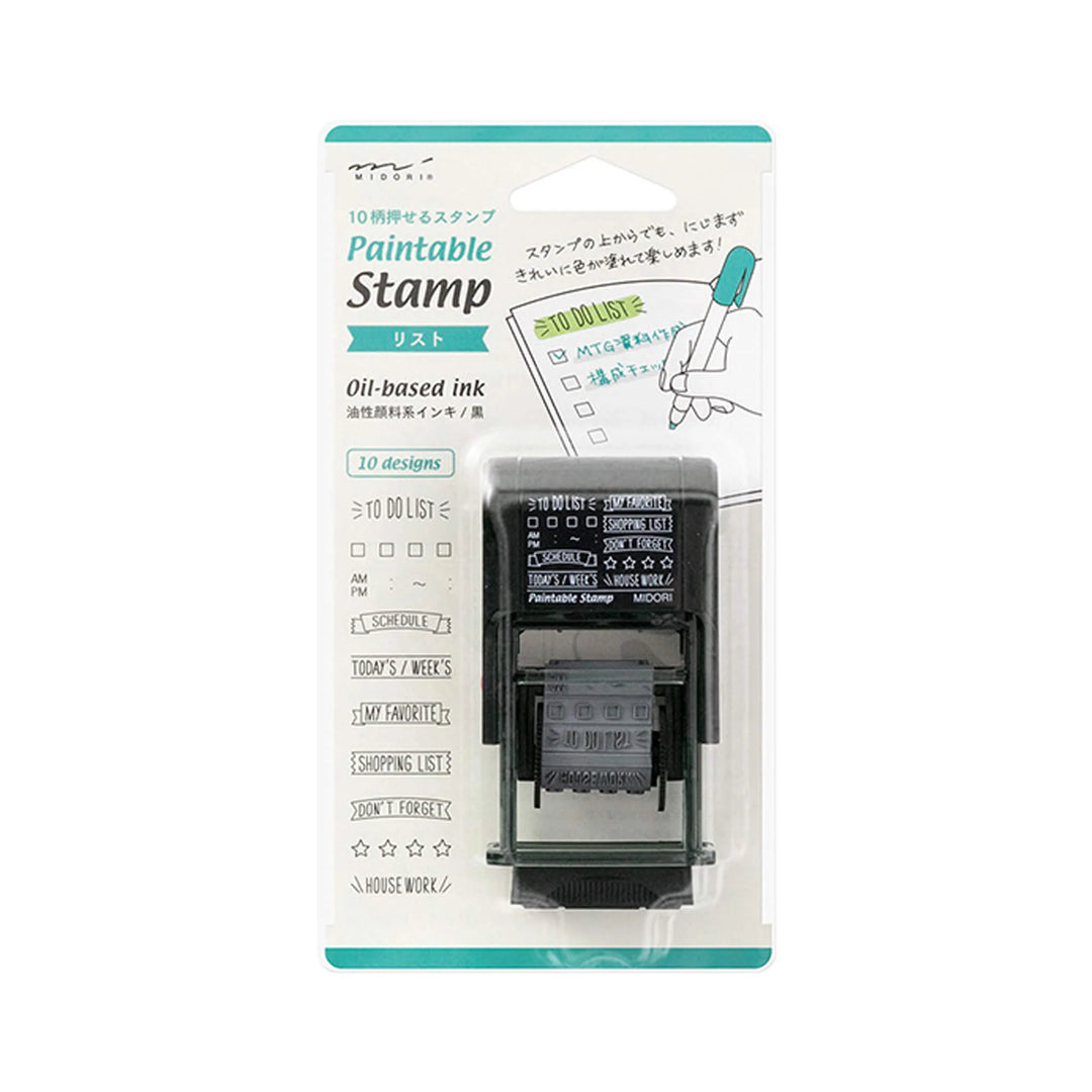 Midori Paintable Rotating Stamp Dial – List with rotating dial and list-style stamp designs, compact body, and built-in black ink pad for planners and journals.