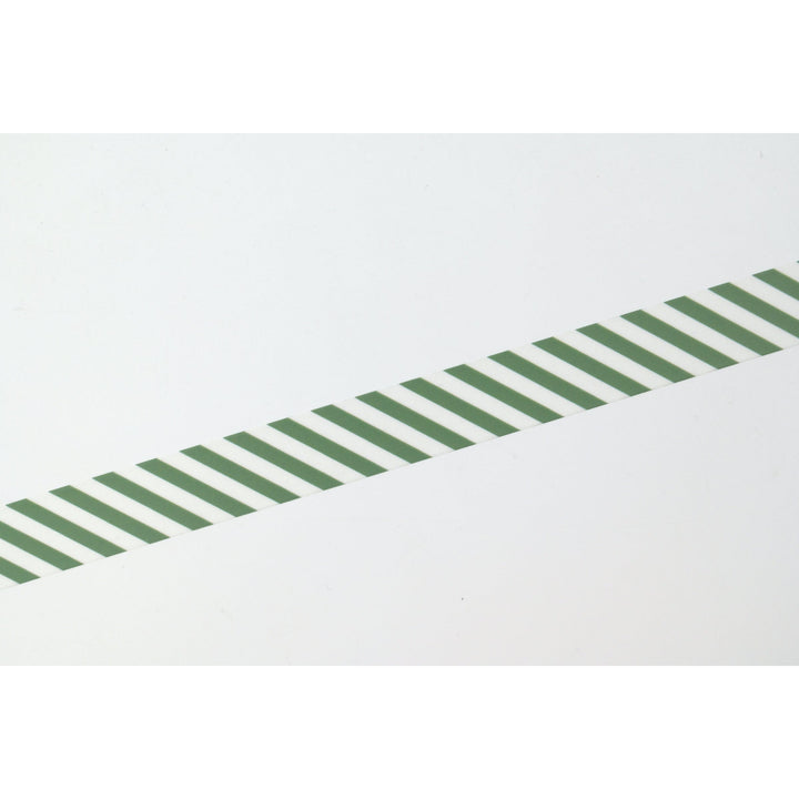 MT 1P Stripe washi tape in Deep Green applied as a diagonal strip, close-up of the stripe pattern